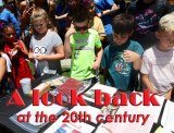 Lemoore Recreation Department day campers get a close look at many of the items retrieved from the Heritage Park time capsule opened Friday, June 14.